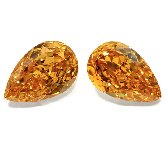 1.17ct Pear Shape, Fancy Vivid y. Orange Diamond (Pair), VS1/VS2 - GIA