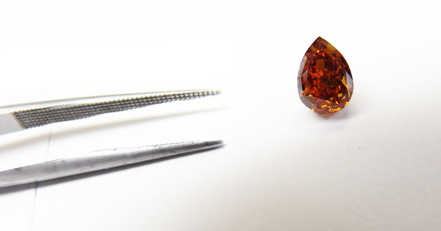 0.62ct Pear Shape, Fancy Deep Reddish Orange Diamond, VS1 - IGI