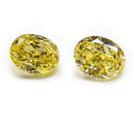 0.90ct Oval, Fancy Vivid Yellow Diamond (Pair), SI1 - GIA